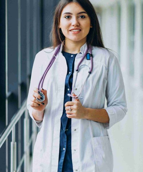 Young woman doctor with stethoscope at hospital